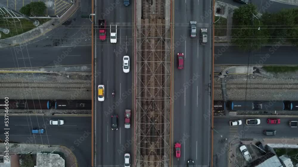 train going around and cars in the highway train going around and cars in the highway