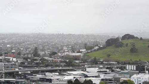 Highway one with busy traffic along Mount Hobson on a grey, hazy day in Auckland, New Zealand photo