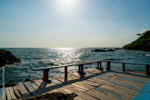 empty balcony and wooden bench with coast and sea background at Chedi Klang Nam in Chanthaburi, Thailand © topntp