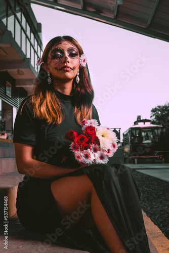 High quality photography. Day of the dead, Dia de los muertos character. Close Up portrait of Calavera Catrina. Dia de los muertos. Day of The Dead. Halloween. woman in catrina makeup and white flower