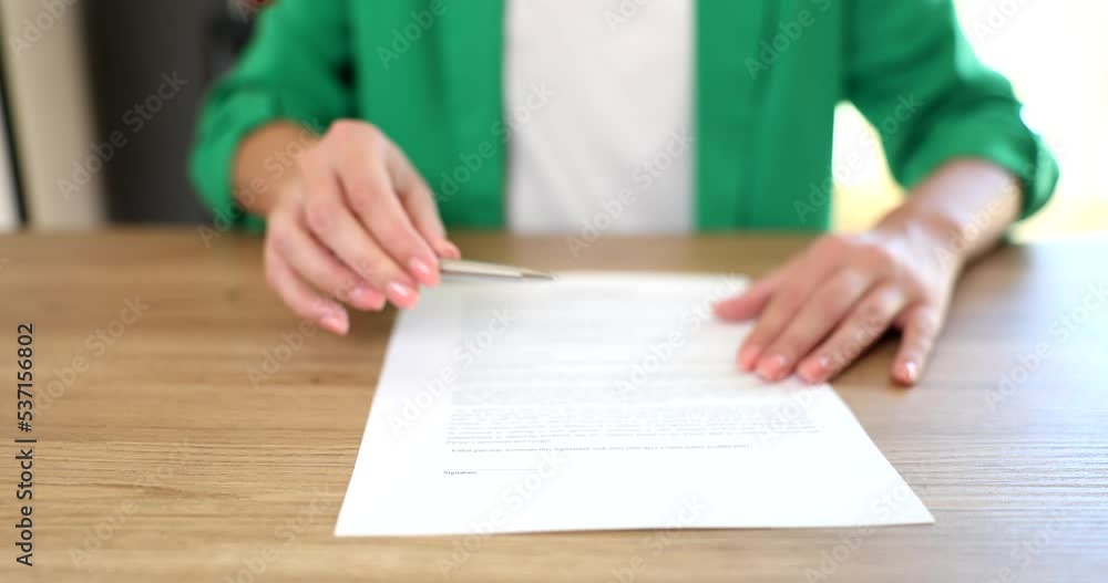 Woman offers pen to sign new employment contract and partner promises good deal Woman offers pen to sign new employment contract and partner promises good deal