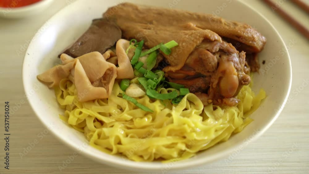 Egg noodles served dry with braised duck  - Asian food style