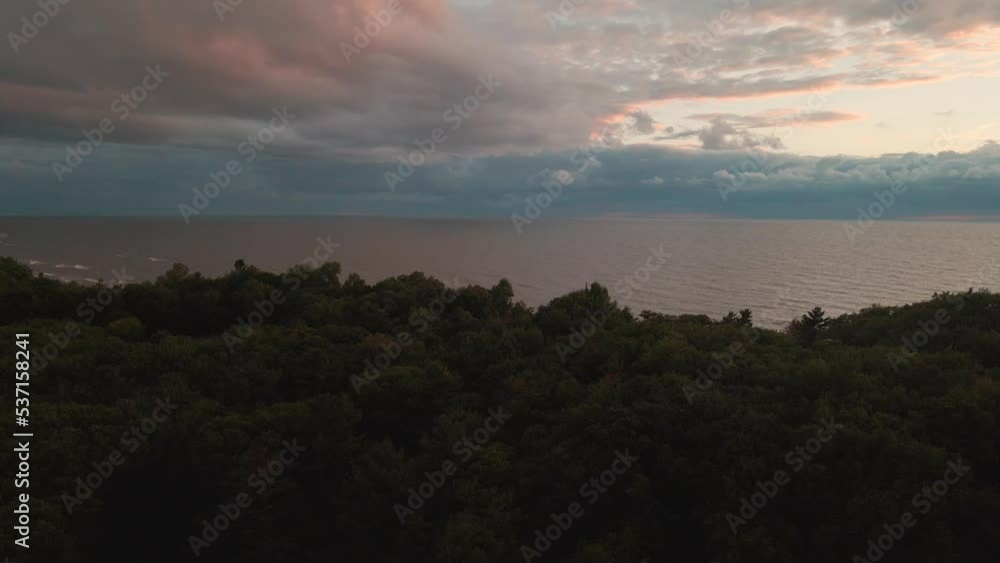 Reverse track and pan across Lake Michigan neighborhood during a storm. Reverse track and pan across Lake Michigan neighborhood during a storm.