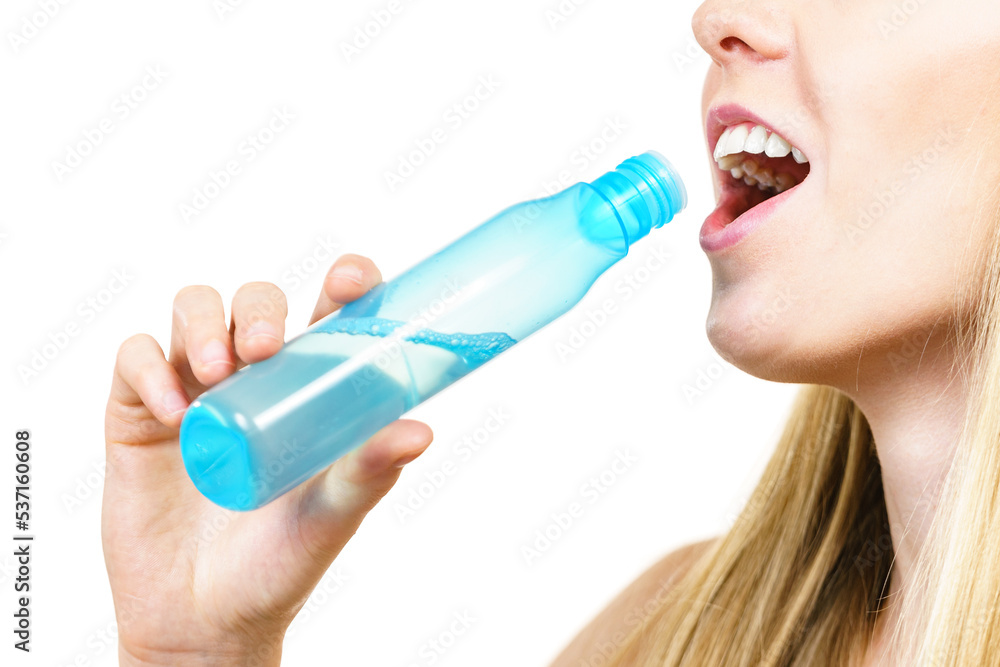 Smiling woman holding bottle of liquid cosmetic, having fun, enjoying morning routine procedure for skincare. Beauty therapy concept. Smiling woman holding bottle of liquid cosmetic, having fun, enjoying morning routine procedure for skincare. Beauty therapy concept.