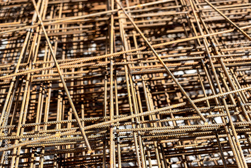 Rebar, reinforcing bars or steel close up, reinforcement steel, wires mesh of steel used as a tension device in reinforced concrete. © Anoo