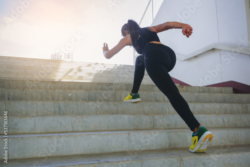 Принти на полотні Young woman running sprinting up stairs