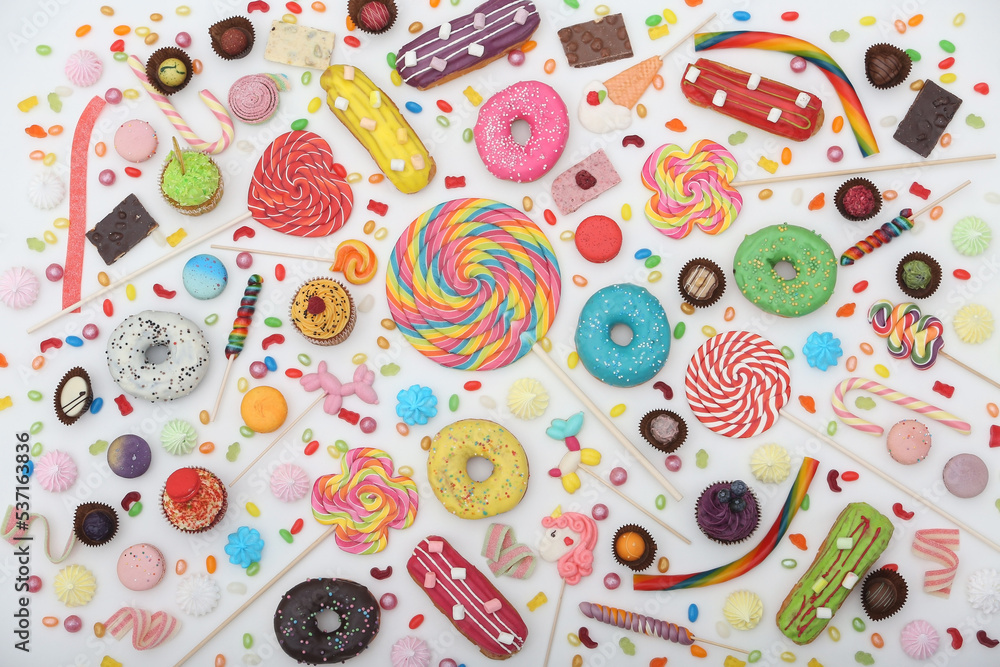 Huge amount of various sweets on white background. Confectionery: candy, lollipops on stick, sweet, sugar. Many delicious of rainbow donuts. Colorful postcard with sweets, lollipops. Dessert, sweet Huge amount of various sweets on white background. Confectionery: candy, lollipops on stick, sweet, sugar. Many delicious of rainbow donuts. Colorful postcard with sweets, lollipops. Dessert, sweet