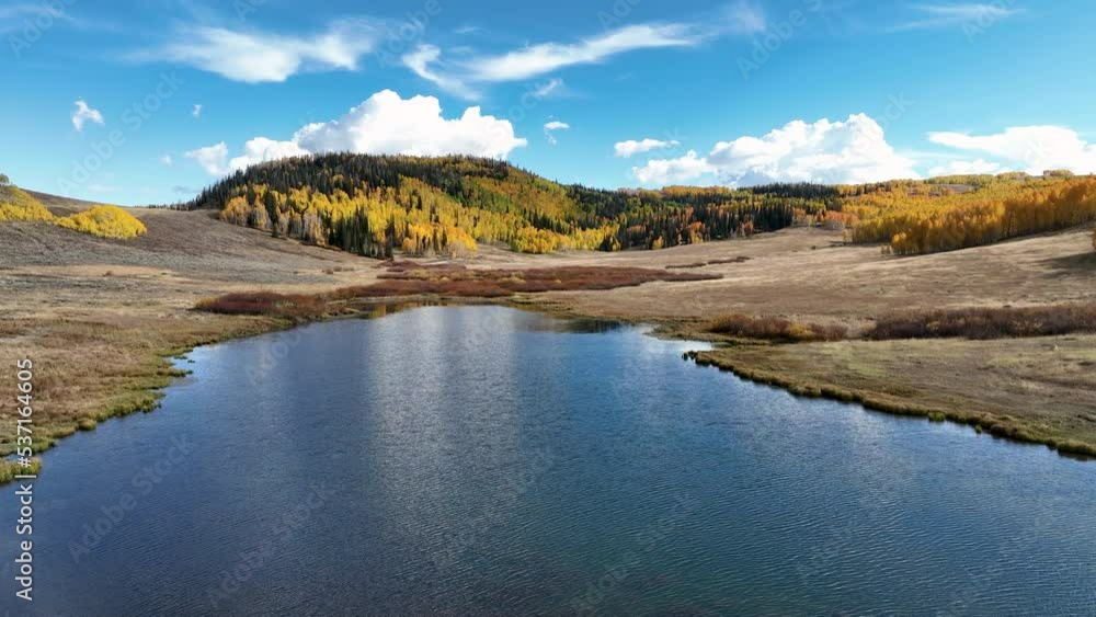 Aerial mountain lake autumn colors fast. Beautiful season fall colors in Maple, Oak and Pine forest. Central Utah. Alpine lake. Travel destination. Exploring natural landscape before winter. Aerial mountain lake autumn colors fast. Beautiful season fall colors in Maple, Oak and Pine forest. Central Utah. Alpine lake. Travel destination. Exploring natural landscape before winter.
