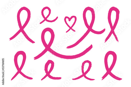 Set of hand drawn pink ribbons. Symbol of the fight against breast cancer. Vector illustration.