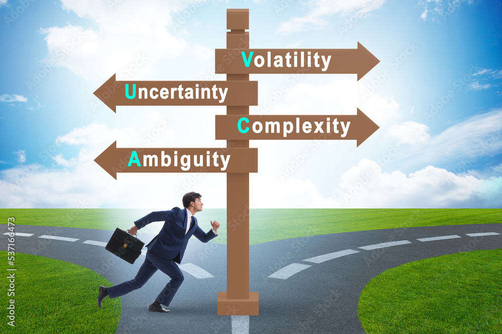 Businessman at the crossroads at VUCA concept Businessman at the crossroads at VUCA concept