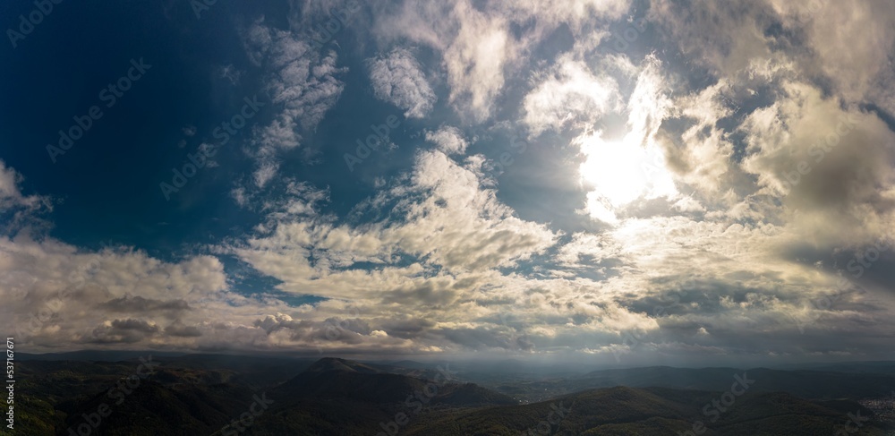 Aerial panorama view of a autumn day in a hilly area near Resita city, Romania. Captured with a drone. Aerial panorama view of a autumn day in a hilly area near Resita city, Romania. Captured with a drone.