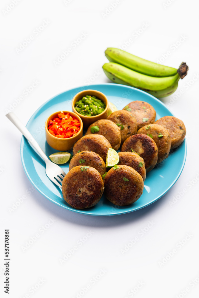 Raw Banana Cutlet also called plantain or kacche kele ki tikki or patties, served with chutney