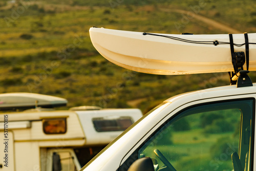 Canoe on roof top of car van © anetlanda