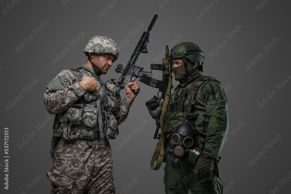 Studio shot of isolated on grey background russia and nato soldiers and their conflict. Studio shot of isolated on grey background russia and nato soldiers and their conflict.
