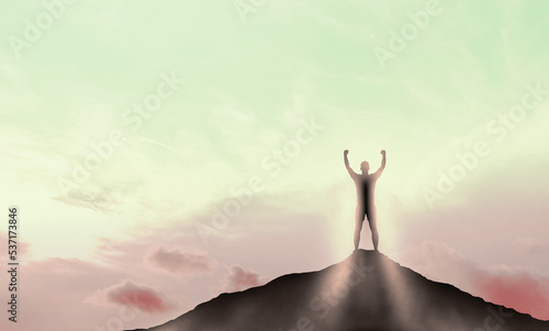 Man Standing Against sunrise. Silhouette man Standing Against sunset sky. success, achievement and goal concept. competition and leadership concept. man standing on top of mountain © Celt Studio