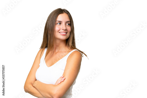 Young pretty woman over isolated background with arms crossed and happy