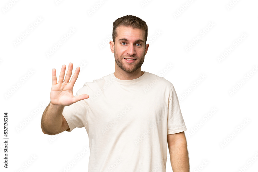 Young handsome caucasian man isolated on green chroma background counting five with fingers Young handsome caucasian man isolated on green chroma background counting five with fingers