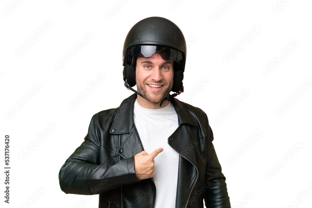 Young caucasian man with a motorcycle helmet isolated on green chroma background with surprise facial expression Young caucasian man with a motorcycle helmet isolated on green chroma background with surprise facial expression