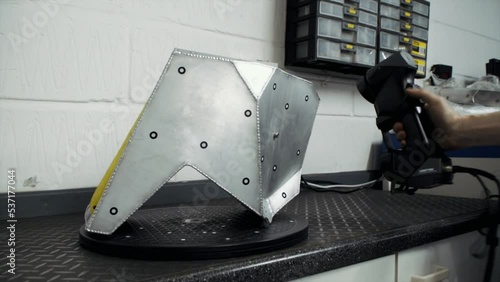 Blue laser 3D scanning tool used for rapid prototyping of race car parts.