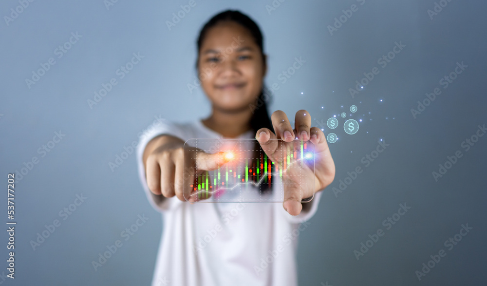 Hologram image of a candlestick chart from a phone on a person's hand. Offer trading, investment ideas Hologram image of a candlestick chart from a phone on a person's hand. Offer trading, investment ideas