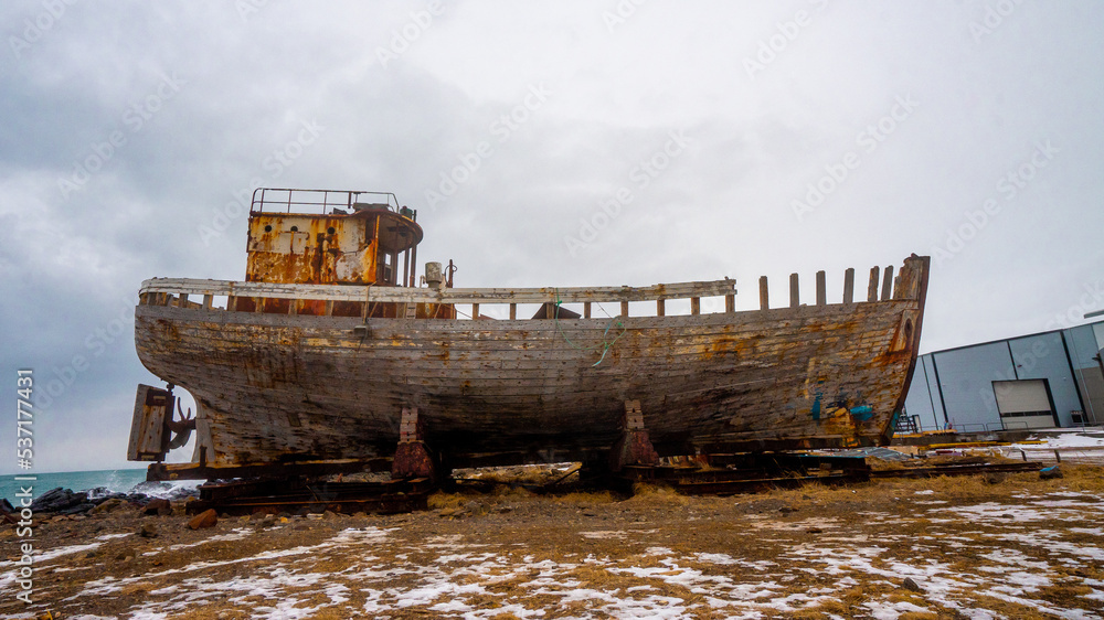 Hofrungur AK 91 Abandoned Shipwreck at Akranes town near Reykjavik during winter cloudy day at Akranes , West Coast of Iceland : 15 March 2020
