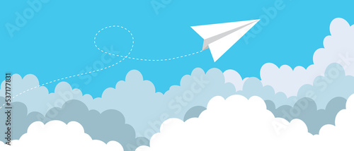 Paper plane flying between clouds. Modern
