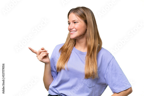 Young beautiful woman over isolated background pointing finger to the side and presenting a product