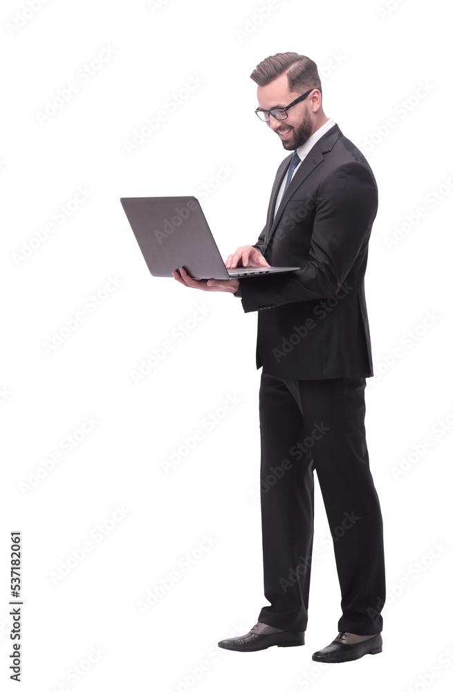 in full growth. businessman with open laptop. in full growth. businessman with open laptop.