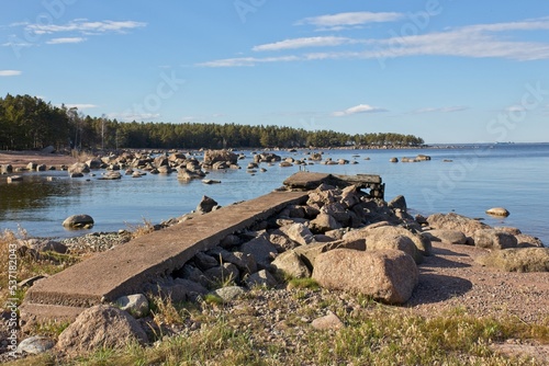 Old concrete pier on a rocky seashore on the island of Kaunissaari, Pyhtää, Finland.