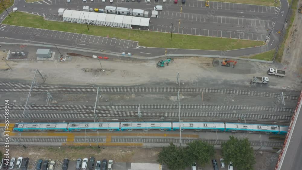 Creative aerial dive bomb shot over modern train and newly developed infrastructure. Creative aerial dive bomb shot over modern train and newly developed infrastructure.