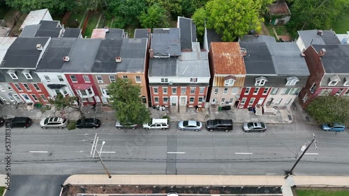 Rowhouses, homes and urban living in USA. City life in dangerous low income community. Aerial truck shot. photo