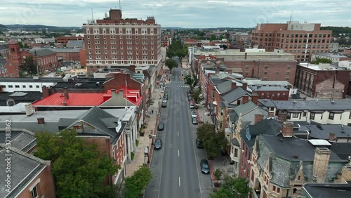 Downtown York Pennsylvania. Aerial of historic buildings in city. Reverse pullback aerial reveal. photo