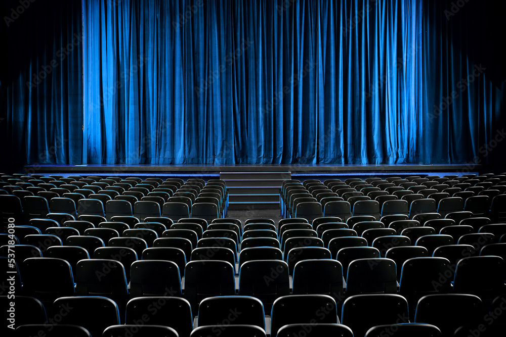 Darkened empty movie theatre and stage - obrazy, fototapety, plakaty 
