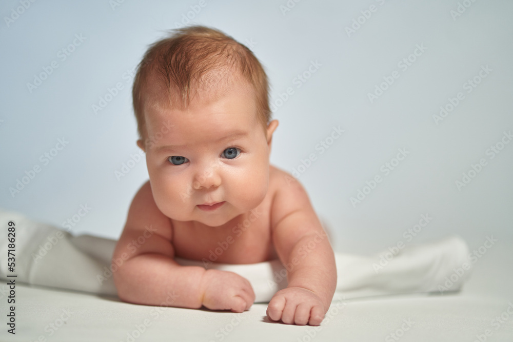 Close-up portrait of a newborn on a light background Close-up portrait of a newborn on a light background