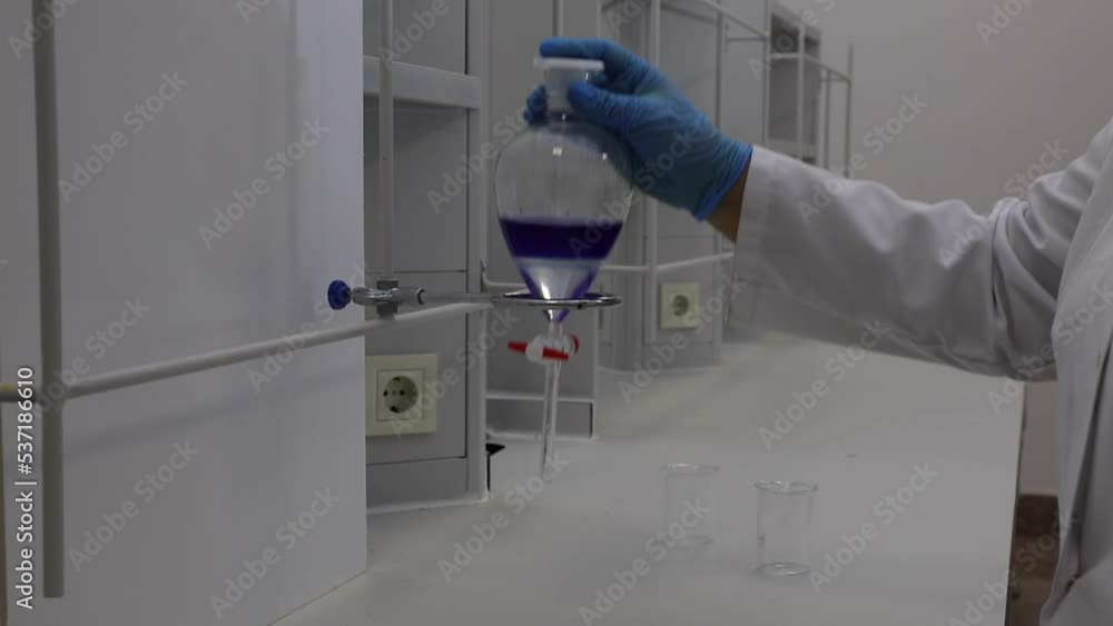 Video Stock Separating funnel laboratory glassware used in liquid