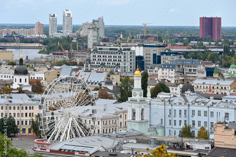 Top view of the Ferris wheel and houses in the city center of Kyiv 