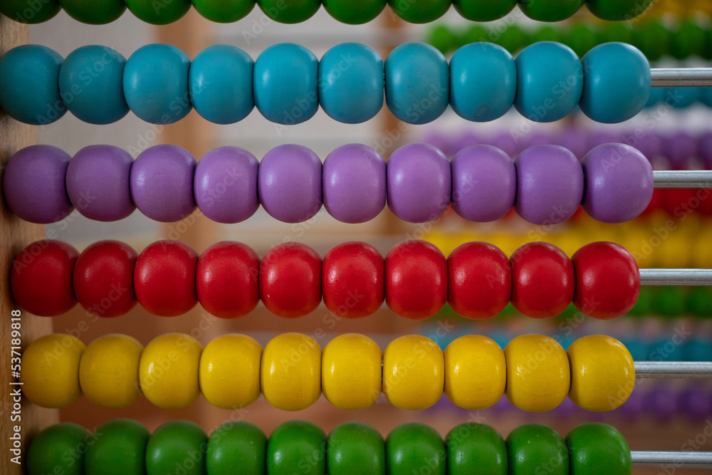 School abacus with colorful beads, closeup view, copy space. Kids learning, kids math class concept School abacus with colorful beads, closeup view, copy space. Kids learning, kids math class concept