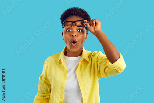 Εκτύπωση καμβά African American woman with funny surprised and shocked expression looking straight at you