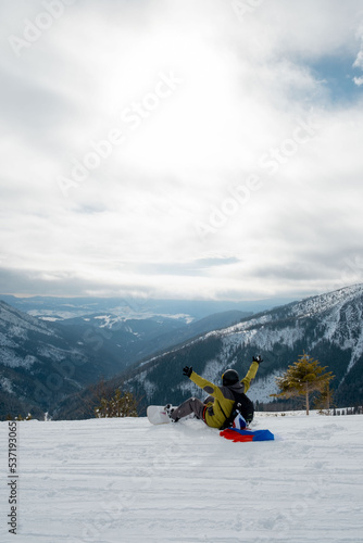 man snowboarder with slovakia flag at ski resort slope