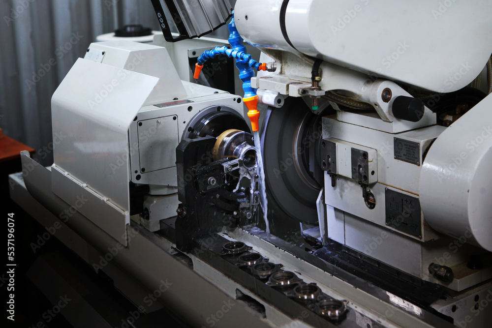 A machine for the manufacture and processing of finished bearings. Production of bearings. Photo on production. A machine for the manufacture and processing of finished bearings. Production of bearings. Photo on production.
