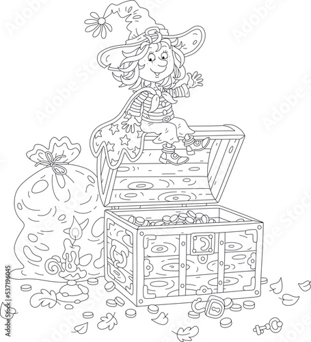 Happy little witch with a burning candle checking a safety of her priceless treasures and gold coins in an old wooden chest in her dusty storeroom, black and white vector cartoon