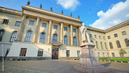 View of Humboldt University in Berlin downtown, Germany. Hermann von Helmholtz statue on the foreground photo