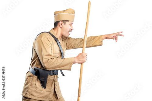 Obraz na plátně Indonesian freedom fighter standing while holding sharpened bamboo stick