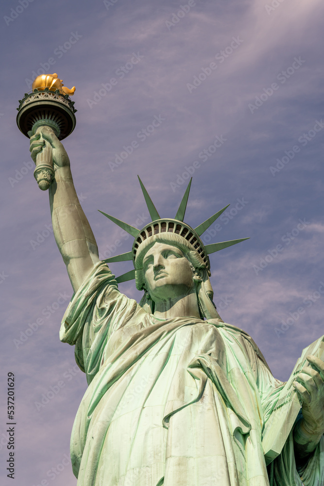 Fototapeta premium Statue of Liberty front view with torch and declaration of independence