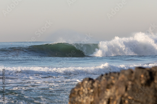 huge wave breaking on the beach © Ryan