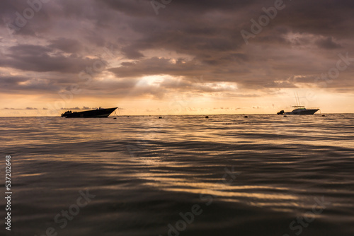 boat on the sea at sunset