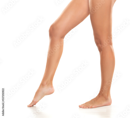 Side profile view of beautiful women legs and panties on a white background © vladimirfloyd