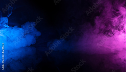 Blue and purple swirly colored smoke clouds flowing on black background with reflection