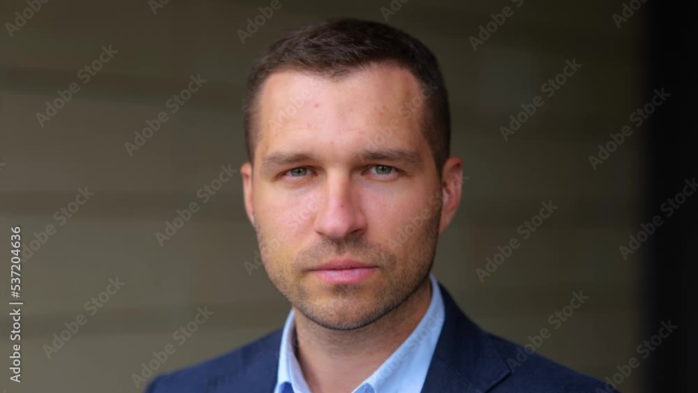 Close up of happy handsome man looking at camera and smiling in good mood. Caucasian cheerful professional male with smile on face. Business successful people. Slow motion Close up of happy handsome man looking at camera and smiling in good mood. Caucasian cheerful professional male with smile on face. Business successful people. Slow motion