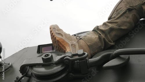 Soldier's boot on tank armor. High quality FullHD footage